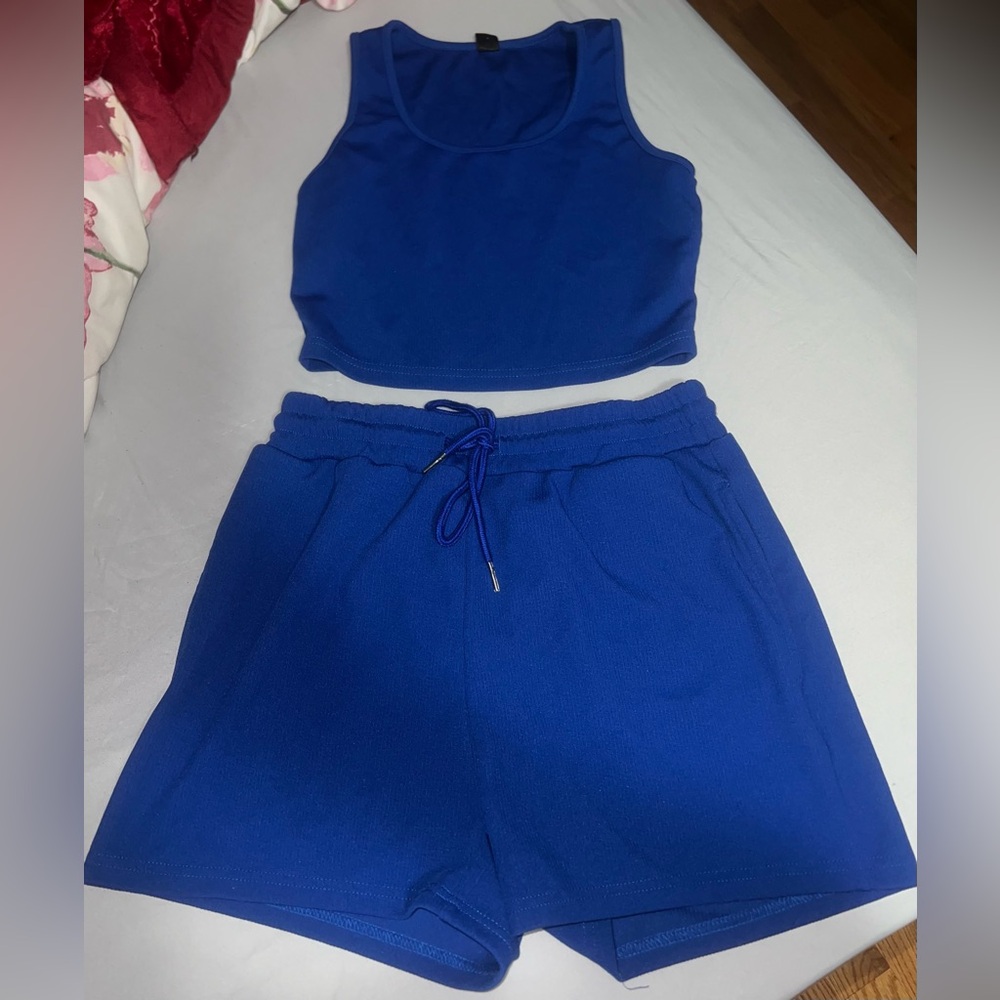 Blue tank and track shorts
